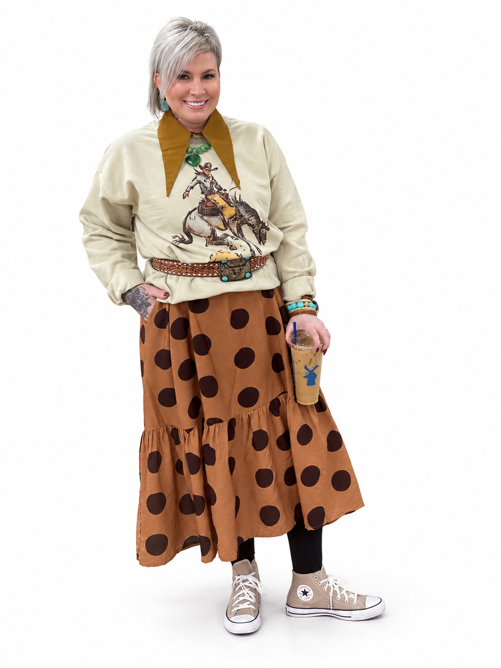 Jennifer wearing a cowgirl sweatshirt and polka dot skirt